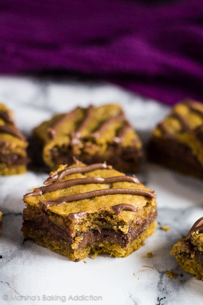 sweetoothgirl:  Nutella Stuffed Pumpkin Cookie Bars