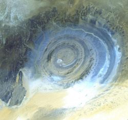 mirkokosmos:  Satellite Picture of The Richat Structure, also known as the Eye of the Sahara and Guelb er Richat, is a prominent circular feature in the Sahara desert near Ouadane, west–central Mauritania. Initially interpreted as an asteroid impact