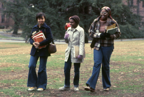 Wishing everyone a stylish and fun fall break!Three Students with Books Walking Across Campus in the