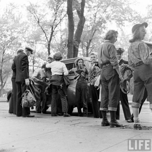 Mountain climbing party gets ready to board the bus(Myron Davis. 1942)