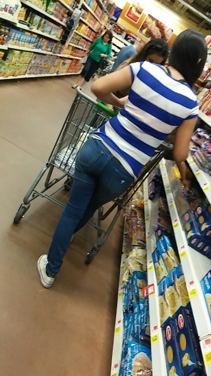 mycandid:  Here is this beautiful tight bodied latina wearing a blue and white stripped top with a n