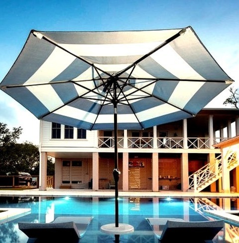 Poolhouse In CharlestonMid-sized Trendy Backyard Stone And Custom-shaped Pool House Photo