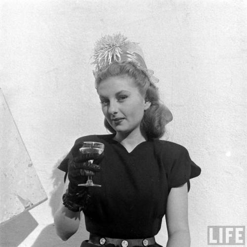 Joan Lording wearing one of her floral hats(George Lacks. 1946)