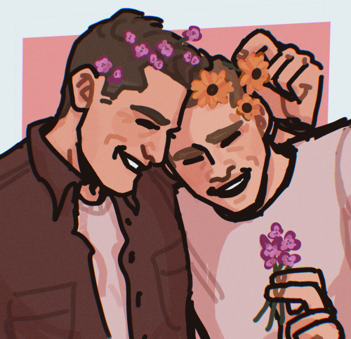 a drawing of tommy and buck from 9-1-1. their heads are ducked together with Tommy’s arm around Buck’s shoulder. they both grinning widely with their eyes closed. the arm tommy has around buck is peeking over Buck’s shoulder to put orange flowers onto bucks hair. Tommy’s hair is littered with small purple flowers, matching the ones that Buck is holding at the bottom of the frame