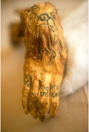 Hand of a mummy, showing off ancient tattoos. porn pictures