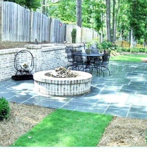 Patio AtlantaPatio - Large Traditional Backyard Tile Patio Idea With A Fire Pit And No Cover