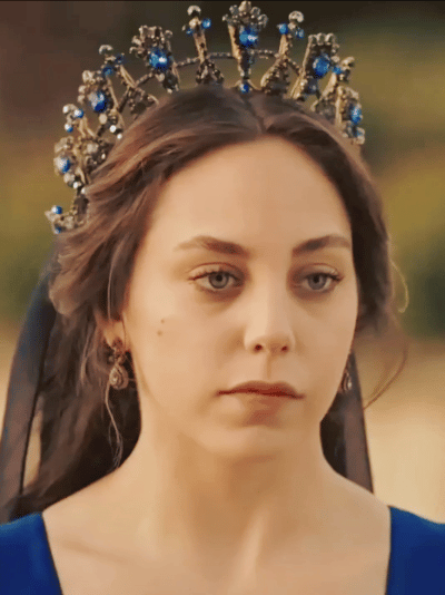 Sultans And Their Colorful Clothes + Dilruba Sultan Is Wearing A Dark Blue Caftan, Yellow Buttons And