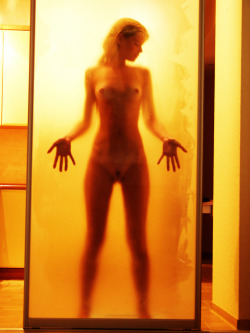 nudepageant:  behind wet glass