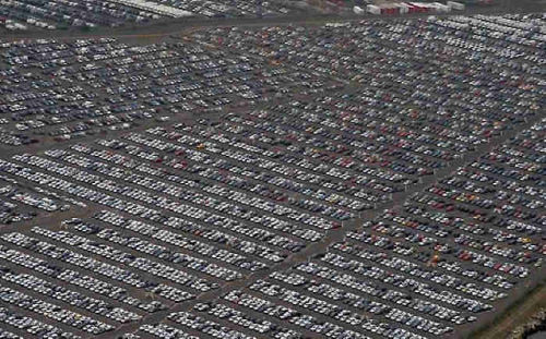 slavery: mansfrombelow:canadian-communist:Where the World’s Unsold Cars Go to Die Above are phot