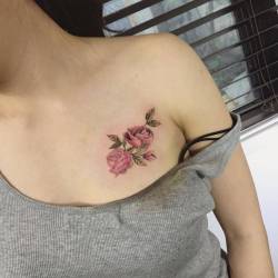 cutelittletattoos:  Rose tattoo on the chest.