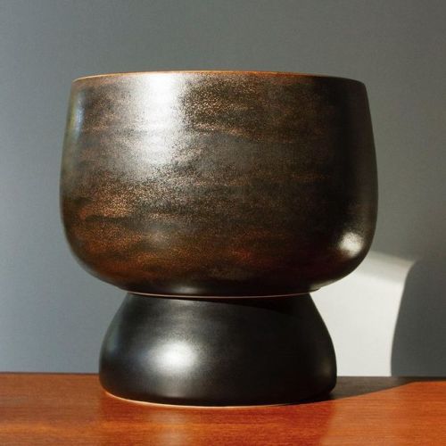 New 2 piece porcelain planter with a shimmering metallic bronze and copper finish and a satin black 