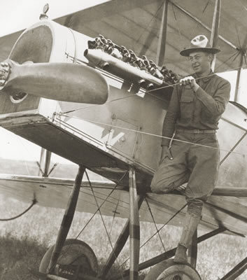 An airman stands on one of six aircraft used by the “Punitive Expeditionary Force” sent 