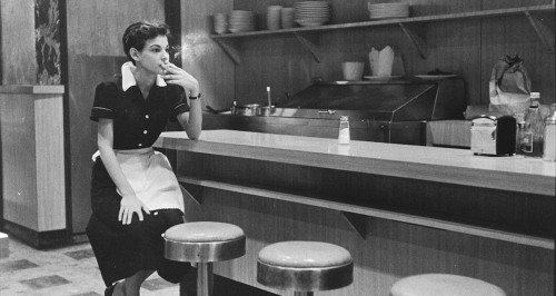 newyorkthegoldenage:  A waitress in a diner taking a break between orders, 1955.Photo: Elliott Erwitt via Jackson Fine Art