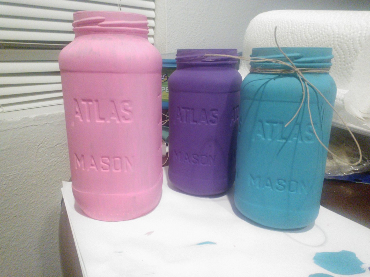 The pretty Mason jars I painted tonight :) The purple one came out best bc the paint