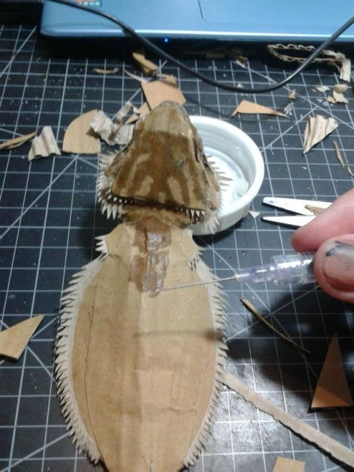 potentialforart: little-vince: Bearded Dragon with cardboard by cardboard artist 鍾凱翔 Zhongkai Xian