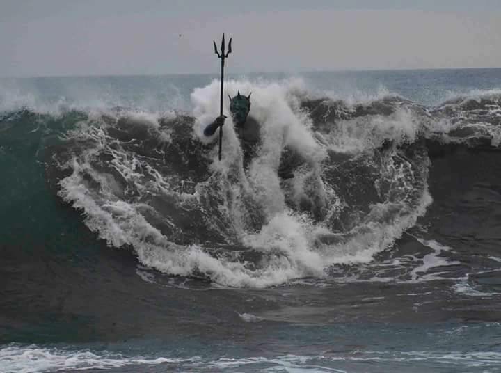 sixpenceee:   A wave engulfs the statue of Neptune on Melenara Beach, Gran Canaria