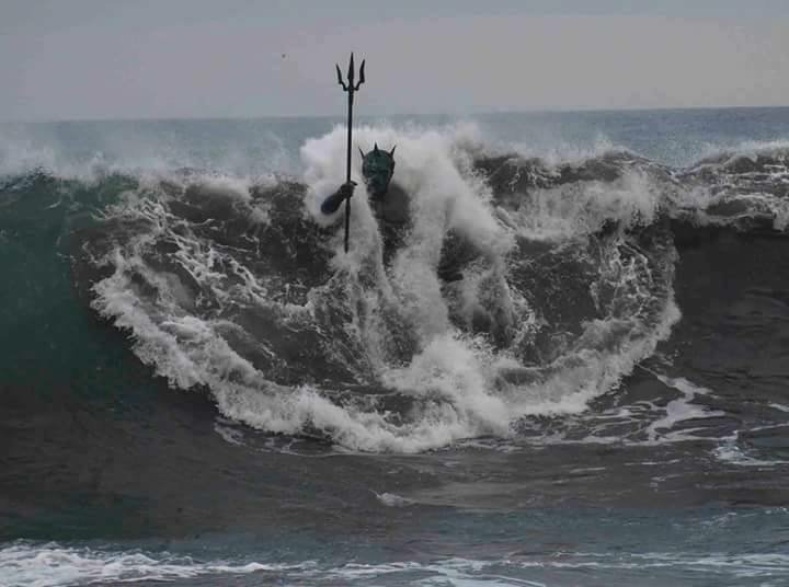 sixpenceee:  A wave engulfs the statue of Neptune on Melenara Beach, Gran Canaria