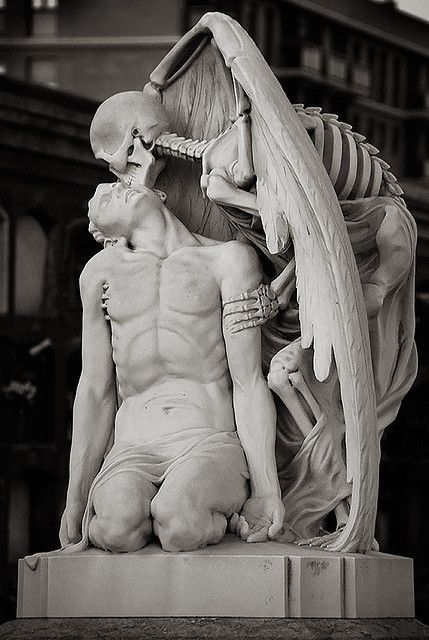 ex0skeletal:  The Kiss of Death is a marble sculpture  by Jaume Barba   in Poblenou Cemetery in Barcelona. Inscribed on the tomb below is the quote:“His young heart is thus extinguished. The blood in his veins grows cold. And all strength has gone.