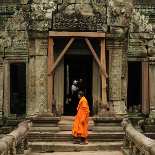 21/365. A Buddhist Monk Pauses At A Gate At Ta Prohm (meaning "ancestor Brahma") To Observe A Tourist