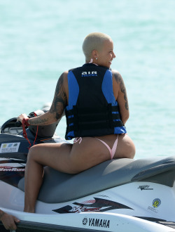 ikonicgif:  Amber Rose goes for a ride on a jet ski in Miami 