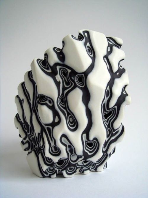sixpenceee:Sandblasted porcelain shows its inner strata.