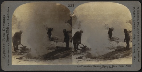 Prospectors burning down a hole north of the Arctic Circle (Alaska,c. 1900).