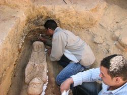 sixpenceee:  Dressed in Roman robes, a 2,000-year-old coffin stares back from a rare Egyptian grave in the Bahariya Oasis. Found in 2010, the carved plaster sarcophagus is only 3 feet long and shows a woman wearing a long tunic, a headscarf, bracelet