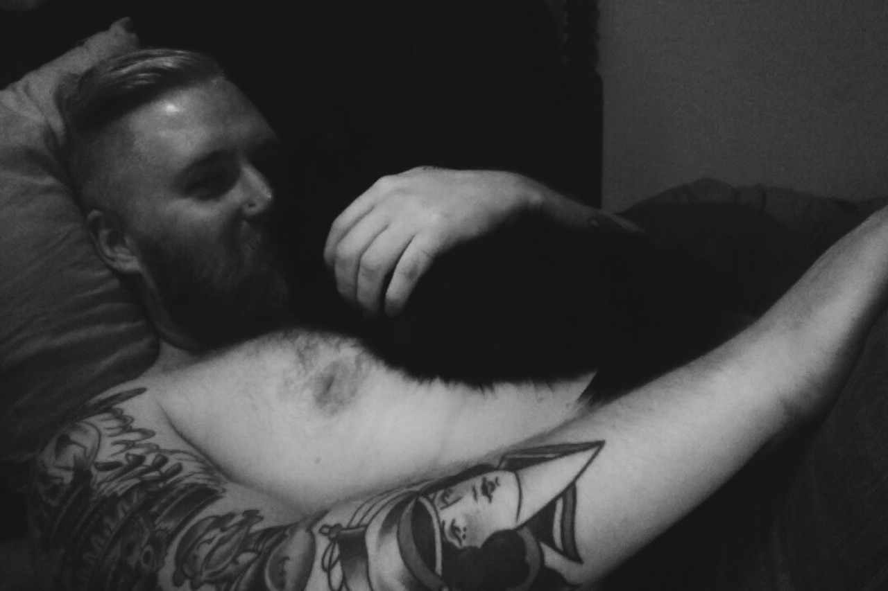 boyswithbeardswithcats:  Me and my lil smoke. I’m basically a cat bed.