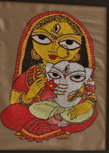 Durga(Parvati) and Ganesh - a very detail and nice embroidery work on silk. This is inspired by the famous artist of Bengal - Jamini Roy. The cloth and posture is of a typical Bengali mother with her beloved son on the her lap.
The person who did...