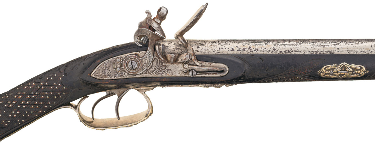 peashooter85:  A double barrel flintlock shotgun with relief carved stock, maker