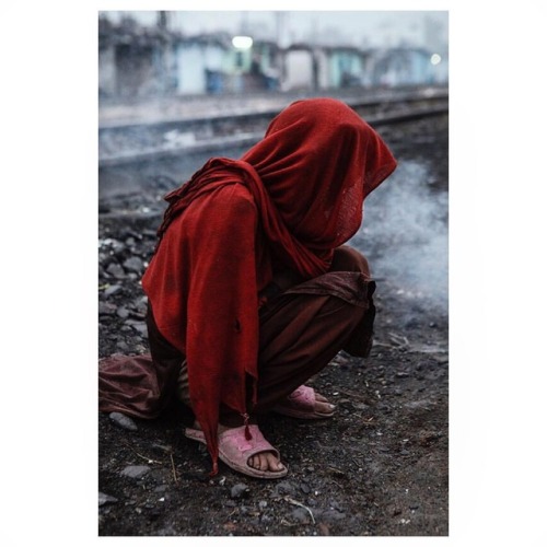 By Salar Kheradpejouh A young girl preparing the fire for the family early in the morning in india #