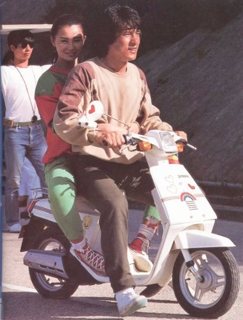 gutsanduppercuts:Jackie Chan giving Maggie Cheung a ride around the set of “Police Story.”Masterpiec