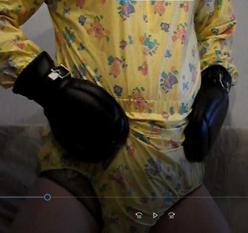 Playsuit and bondage mitts, I can undo my crotch press studs but I can’t get my plastic pants down w