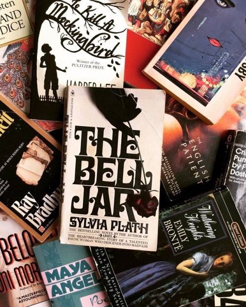 macrolit: Vintage paperback edition of The Bell Jar atop a stack of classics