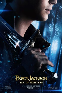 percyjacksonmovies:  Moviefone.com released a new poster for Percy Jackson: Sea of Monsters with Logan Lerman holding Riptide! At the bottom it says, “IN DEMIGODS WE TRUST”. This is my favorite poster so far! What do you think?