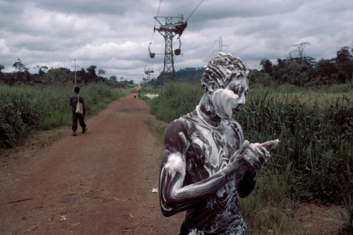 sickpage:  Bruno Barbey  GABON. 1984. A worker at a manganese mine washes himself near the plant of Moada.  