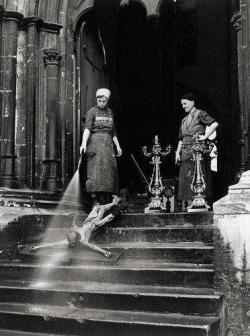 thewolfbroughtindoors:  historicaltimes:   Cleaning women washing a crucifix, 1938 via reddit   Me, thinking they’re hosing an emaciated child down the stairs: oh jesus… Me, realizing it is in fact our lord and savior on the cross: oh, Jesus… 