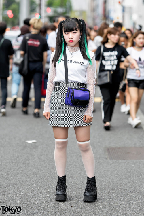 17-year-old Misaki on the street in Harajuku wearing a trendy summer style with a sleeveless top ove