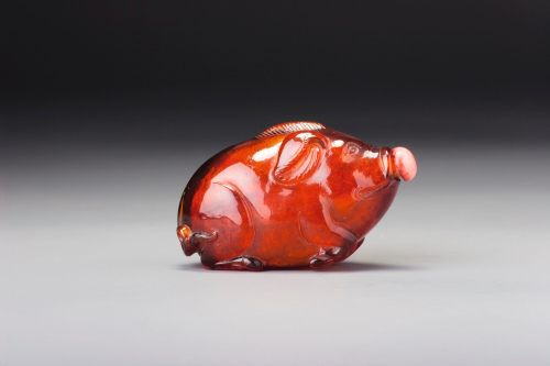 An amber ‘Resting Pig’ snuff bottle, Qing Dynasty, 18th /19th CenturySotheby’s