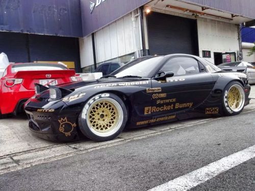 vagina-tickler:  stancedautos:  The real life end result of the renderings  I still dislike rocket bunny cars but damn the rear overs go really well on the fd the rest of the kit looks like poop still, front bumper makes the car look like it has a stupid