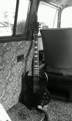 poorcelestialsoul:  I really miss when we had a VW bus that didn’t run, but we used as a hang out/neighborhood observation post/smoke shack/time machine anyways. Oh, and here is the Gibson SG. Two of my most favorite things. 