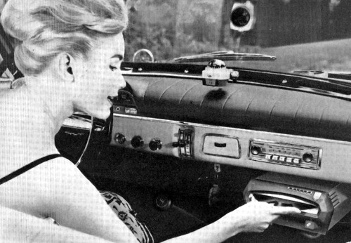 Vintage photographs of a time when cars had vinyl record players. See more here…