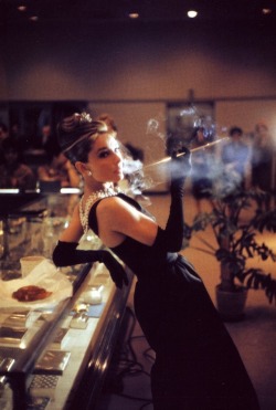 audreyhepburnforever: Audrey photographed by Howell Conant in a promotional shot for ‘Breakfast At Tiffany’s’.