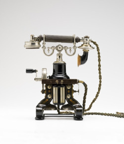 design-is-fine:  L.M. Ericsson, Eiffel Tower Table Top Telephone, in production from 1892-1929. Sweden. Exhibition Interface, Powerhouse Museum, Sydney.One of the first telephones to incorporate microphone and receiver elements into a single handset and