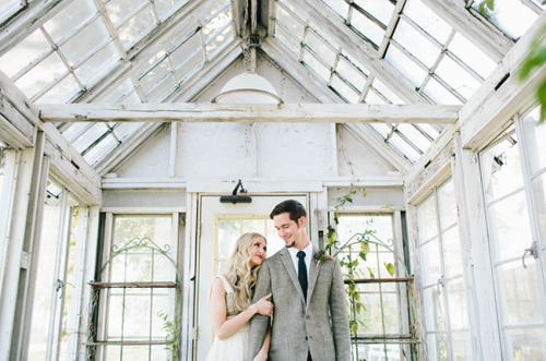 Adorable first look! I would have the whole wedding in this gorgeous old greenhouse. Photographed by