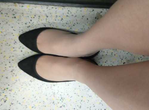 A more pointed toe on a black faux suede ballet flat