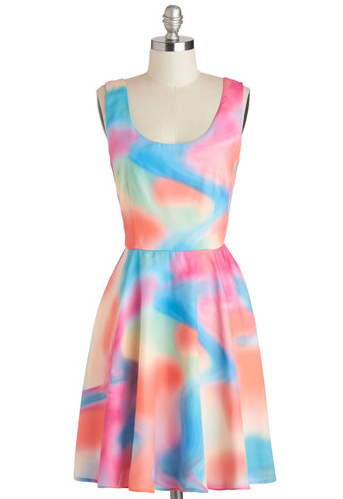 The A Good Vibrant Dress, exclusive to ModCloth, combines the summer-y shades of sherbet and snow cones with a mesmerizing swirl motif. Pair it with blue heels and hit the dance floor!