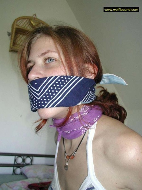graybandanna:  While she was still bandanna bound and gagged, at least the captor was nice enough to remove the scarf stuffing and the bandanna tied over her mouth