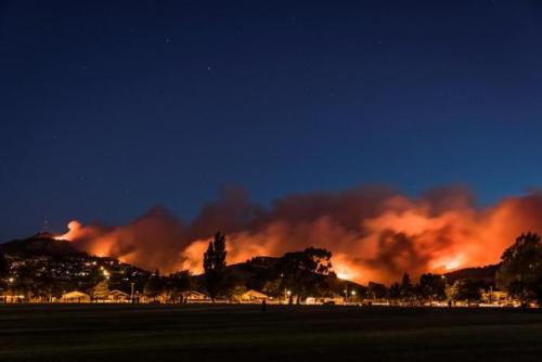 Wildfires threaten a suburb of Christchurch on New Zealand’s South Island taken after sunset. 