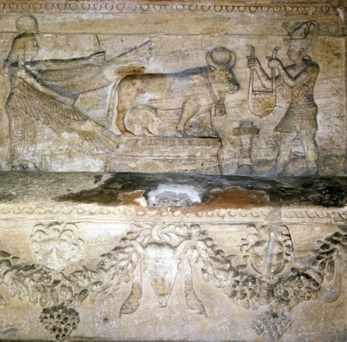 Relief depicting a pharaoh placing a collar on the Apis bull, 2nd century AD. Catacombs of Kom El Sh